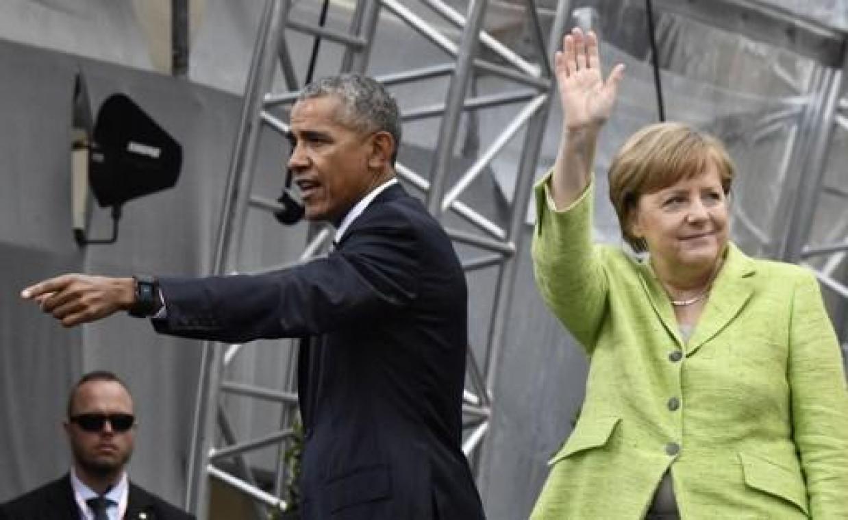 Ex-president Obama, op bezoek bij Merkel, hoopt op ommekeer VS-klimaatbeleid