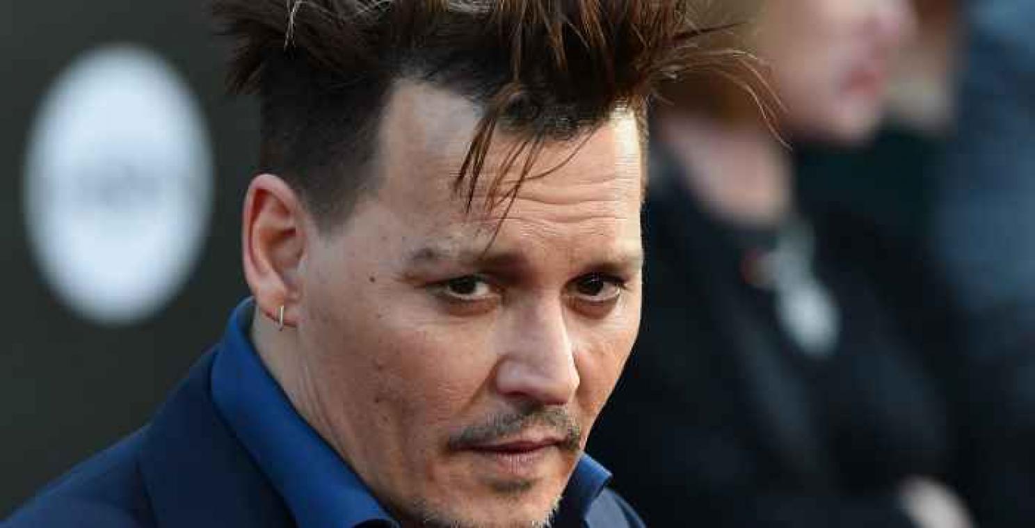Johnny Depp past tattoo over Amber Heard aan