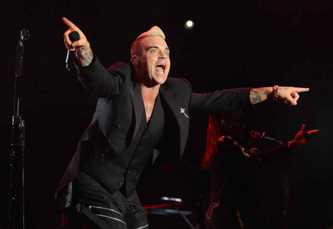 Robbie Williams komt als headliner terug naar de wei van Werchter
