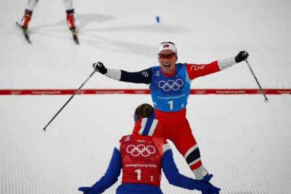 Björgen evenaart Björndalen met 13e olympische medaille