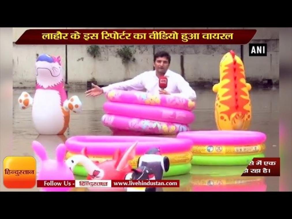 VIDEO. Reporter doet verslag over overstromingen vanuit roze zwembadje