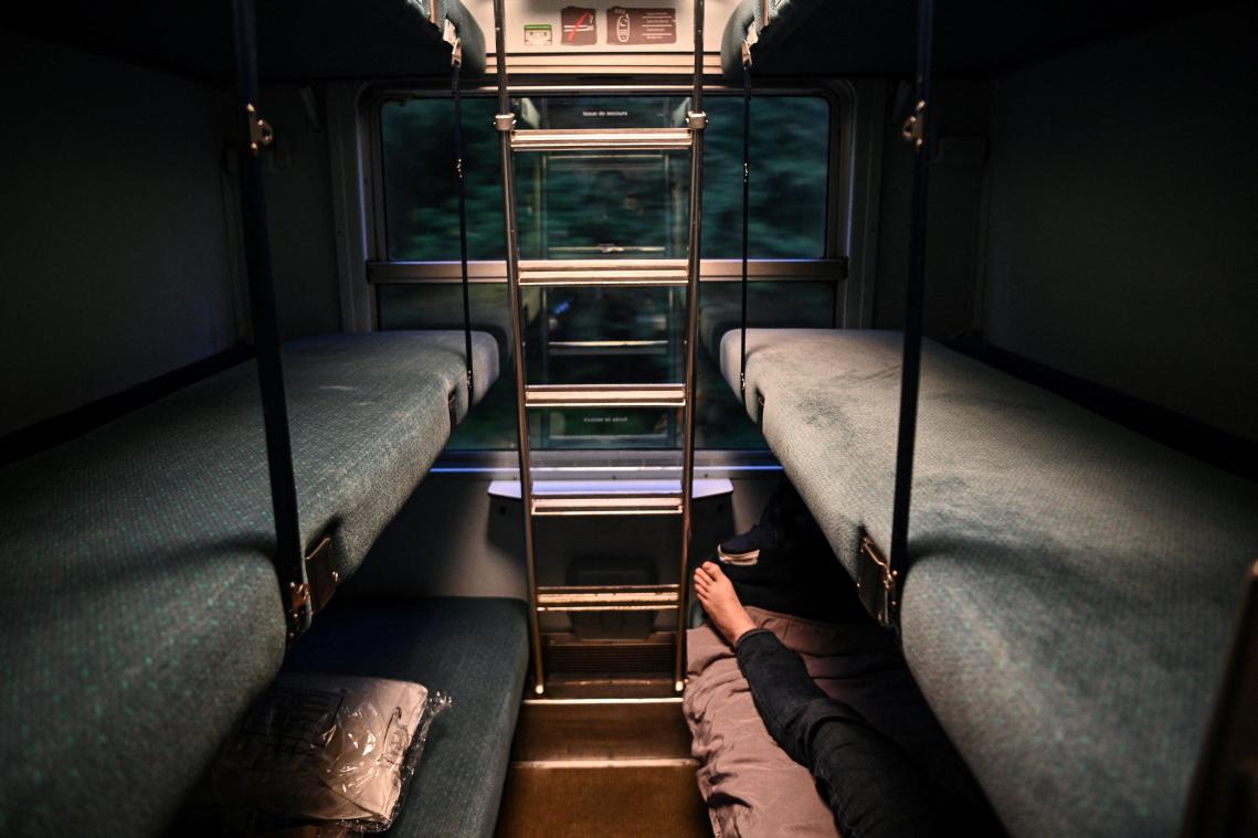A Traveler is installed in a sleeper car of the Paris-Nice night train, between Paris and Nice, on May 20, 2021 on the day it returns to service after being stopped since December 2017. (Photo by Anne-Christine POUJOULAT / AFP)